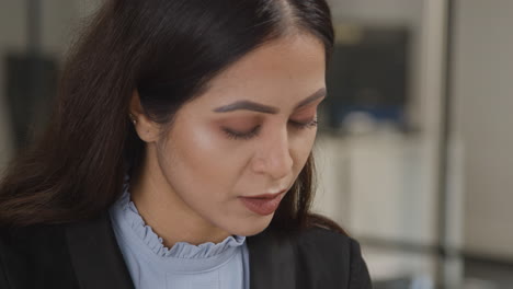 Close-Up-Shot-of-Woman-Speaking-at-Work