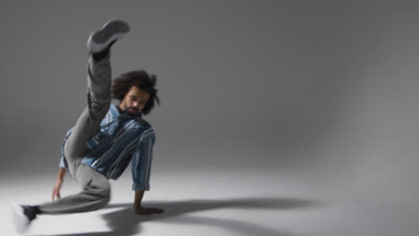 Long-Shot-of-Man-Breakdancing-with-Copy-Space