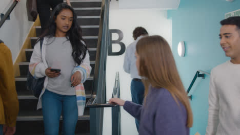 Tracking-Shot-of-Students-Walking-In-Stairwell-01