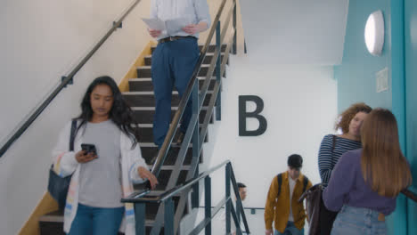 Tracking-Shot-of-Students-Walking-In-Stairwell-05