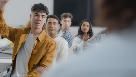 Over-the-Shoulder-Shot-of-Engineering-Teacher-Talking-to-His-Class-11