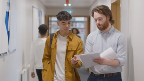 Tracking-Shot-of-Students-Walking-Down-a-Hallway