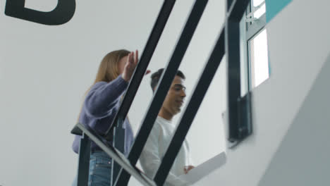 Tracking-Shot-of-Students-Walking-In-Stairwell-06