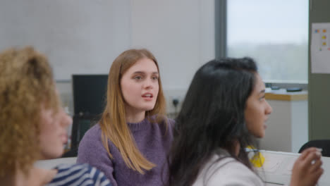 Medium-Shot-of-Students-Asking-Questions-During-Lesson