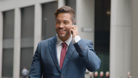 Businessman-Outside-Office-Talking-On-Mobile-Phone