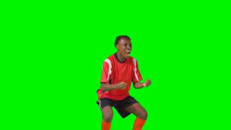 Portrait-Of-Young-Male-Footballer-Wearing-Club-Kit-Celebrating-Goal-Against-Green-Screen-4