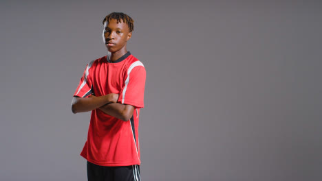 Studio-Portrait-Of-Young-Male-Footballer-Wearing-Club-Kit-Ready-For-Game-2