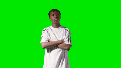 Studio-Portrait-Of-Young-Male-Footballer-Or-Sportsperson-Wearing-Club-Kit-Against-Green-Screen-3