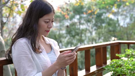 girl-using-mobile-phone-texting-and-reading