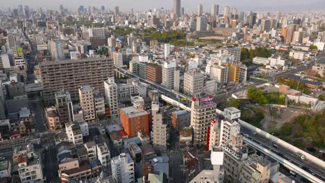 Car-traffic-aerial-view-of-Osaca-City.-High-rise-buildings-and-road-top-view.