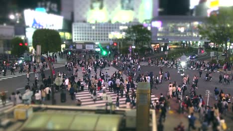 Slow-motion-people-at-Shibuya-Crossing-at-night-Tokyo,-Japan