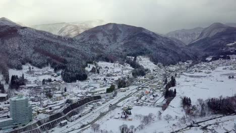 Aerial-view-of-snow-in-winter-at-Yamanouchi-in-Nagano,-Japan