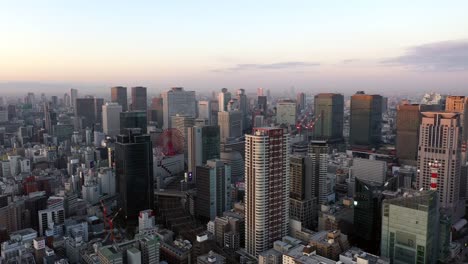 Aerial-view-over-Osaka-city-with-many-skyscrapers-in-the-morning.-Osaka-is-the-capital-city-of-Osaka-Prefecture,-the-second-largest-metropolitan-area-in-Japan.