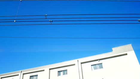 Transportation-Video-of-The-view-from-the-shinkansen-train-window-is-moving-through-the-stations-in-the-city,-which-is-located-on-the-route-of-the-Shinkansen-rail-in-transportaion-and-travel-concept.