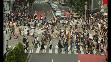 Tokio,-Japan.-Tagsüber-Timelapse-von-Menschen-zu-Fuß-im-Shibuya-Kreuzung-in-die-Nacht