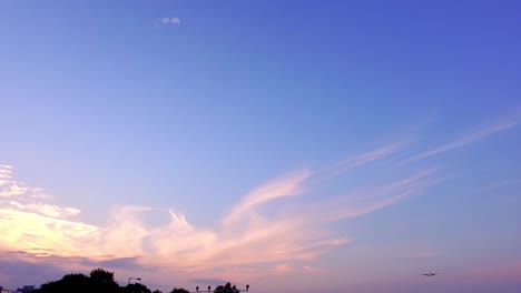 Airplane-flying-in-autumn-sunset-in-slow-motion