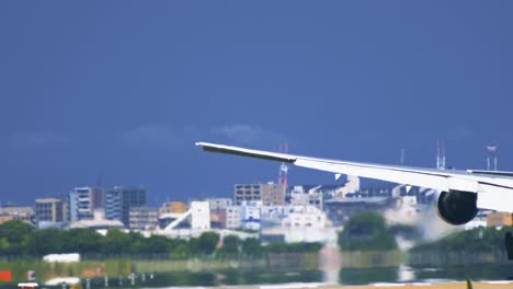 Airplane-touchdown-on-airport-runway-from-behind-in-extremely-closeup