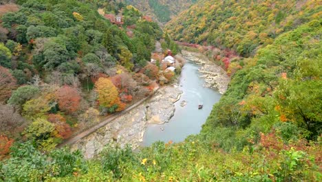 Aerial-view-of-Katsura-river-in-autumn-season-from-Arashiyama-viewpoint,-Kyoto-Japan