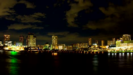 Noche-olvido-4K-junto-a-la-bahía-de-Tokio-ancho-tiro-zoom-en