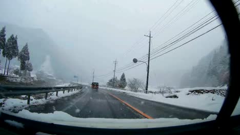 POV-car-driving-in-snow-in-winter,-Route-179,Misasa,-Tottori-Prefecture,-Japan