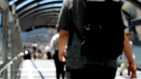 Anonymous-crowd-of-people-walking-on-walk-way-in-holiday