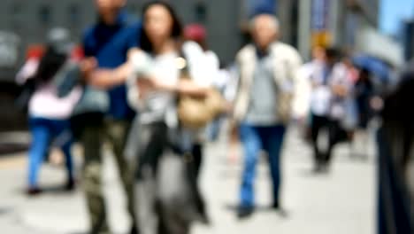 Anonymous-crowd-of-people-walking-on-walk-way