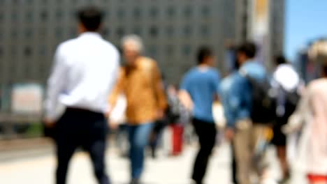 Anonymous-crowd-of-people-walking-on-walk-way