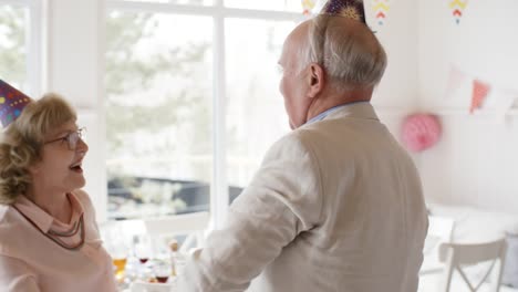 Joyous-Senior-Couple-Dancing-at-Party