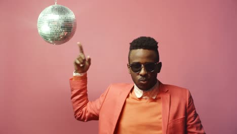 Cool-Man-with-Disco-Ball-on-Pink-Background