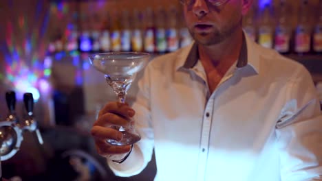 man-bartender-working-on-brew-dip-and-drop-fruit-cocktail-to-make-fruit-cocktail-serving