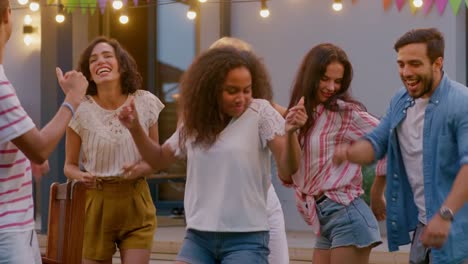 Family-and-Friends-Dancing-together-at-the-Garden-Party-Celebration.-Adults-and-Children-Having-Fun-at-the-Backyard-on-one-Summer-Evening.