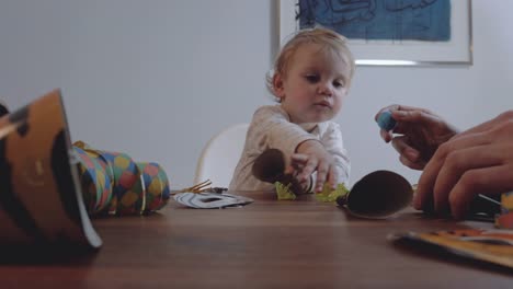 Baby-at-Table-With-Party-Objects