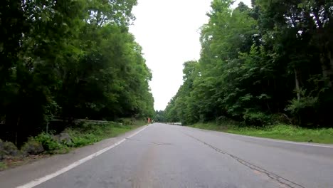 4K-Point-of-view-car-driving-through-highway-mountain-in-Japan