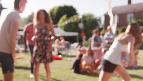 Defocused-view-of-busy-summer-garden-fete