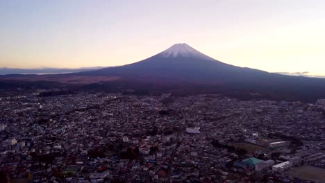 Aerial-view-of-Fuji-mountain-at-sunset-in-Fujikawaguchiko,-Yamanashi.-Urban-city,-Japan.-Landscape-with-architecture-buildings