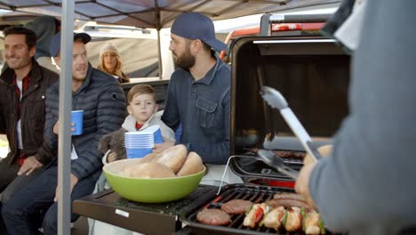 Slow-Motion-Shot-Of-Sports-Fans-Tailgating-In-Parking-Lot