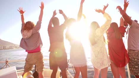 Multi-ethnic-group-of-friends-looking-at-horizon-from-a-yacht