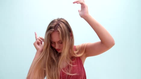Fashionable-young-woman-with-long-messy-hair-dancing