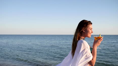 sexual-girl-model-along-of-beach,-summer-rest-on-sea,-young-female-drinks-cocktail