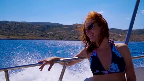 Young-attractive-woman-relaxing-on-a-sailing-yacht.-Girl-having-fun-on-a-yacht.