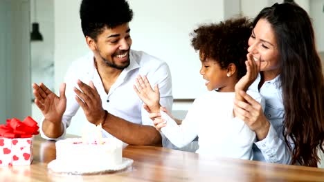 Happy-family-celebrating-birthday-of-their-child