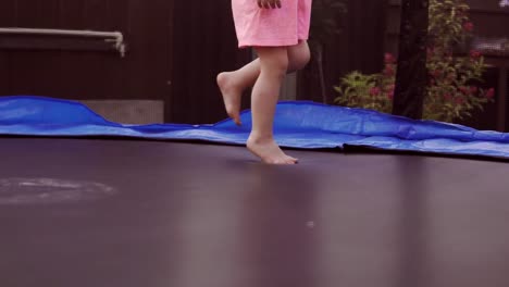 Happy-Girl-Jumping-on-Trampoline.-Funny-Action-in-4k,-UHD