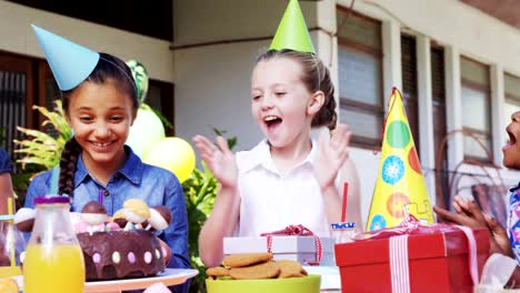 Group-of-kids-celebrating-their-friend-birthday-4k