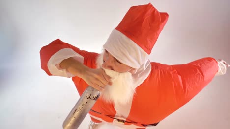 Santa-Claus-drinks-from-a-bottle-and-falls-down.