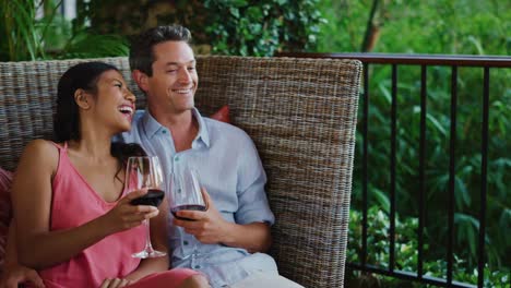 Couple-Enjoying-Glass-of-Wine-at-Luxury-Resort