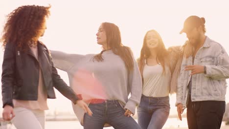 Group-of-young-adults-dancing-outside-and-having-fun