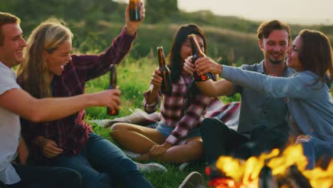 Friends-Relaxing-at-Sunset-Campfire