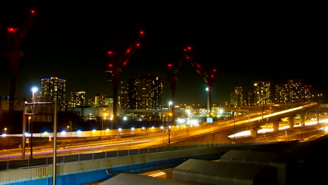 Lapso-de-la-noche-4K-en-Ariake-ancho-tiro-obturador-lento-zumbido-hacia-fuera