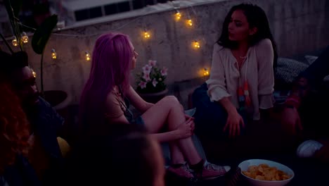 Young-multi-ethnic-hipster-couples-relaxing-at-rooftop-summer-party