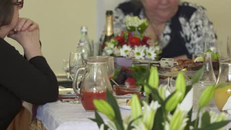 Senior-citizens-celebrate-holidays-at-festive-dinner.